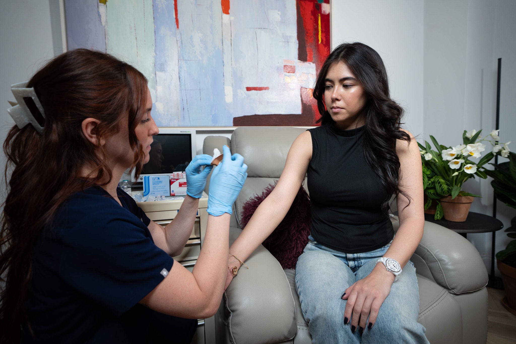 A medical nurse and young patient at Fountain Health NYC treatment suite